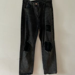 Selling black ripped jeans semi baggy